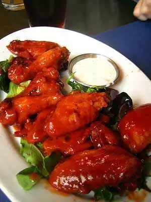 The finished Buffalo-style chicken wings. Photo: CC--rick