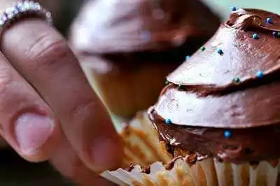 Gluten-free cupcakes get some frosting. Photo: CC--Ariel Waldman Gluten-free cupcakes get some frosting. Photo: CC--Ariel Waldman