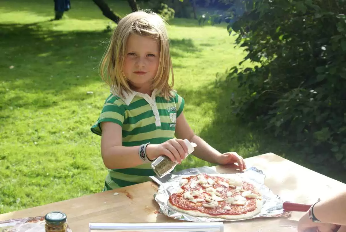 What Brands of Frozen Bread Dough are Gluten-Free? - Pizza making in the garden. Image: CC BY-SA 2.0--PhylB