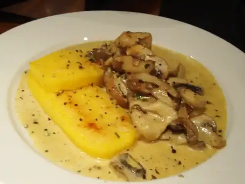 Creamy Gluten-Free Polenta with Wild Mushroom Ragù - Mushroom Polenta @ Strada by ajleon is licensed under CC BY 2.0.