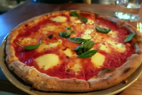 Neapolitan-Style Pizza with Sourdough Gluten-Free Crust - Maybe Frank — Neapolitan pizza and cocktails by Bex.Walton is licensed under CC BY 2.0.
