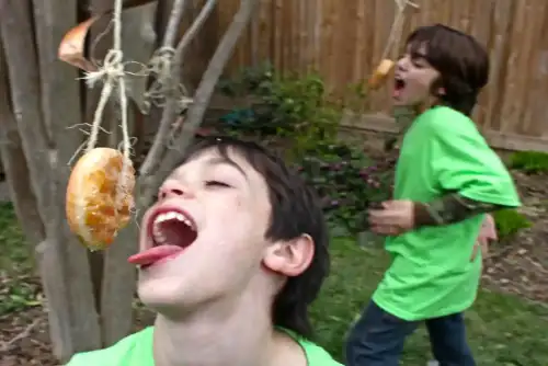 Determinants of Adherence to a Gluten-Free Diet in Children with Celiac Disease (+Video) - donuts on a string [action shot] by woodleywonderworks is licensed under CC BY 2.0.++ Watch the Video ++