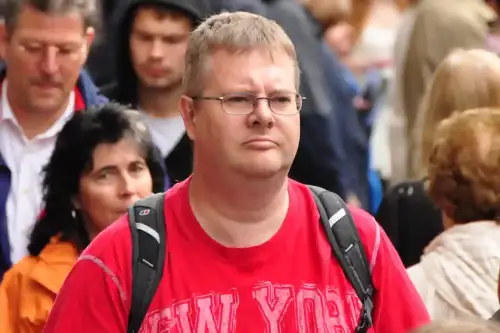 Can You Develop Celiac Disease Later in Life? Adult-Onset Symptoms (+Video) - Middle aged man with glasses walking through Edinburgh Market street by mendhak is licensed under CC BY-SA 2.0.++ Watch the Video ++