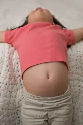Why Many Kids with Celiac Disease Still Have Stomach Pain—Even on a Gluten-Free Diet - Jade's belly by another sergio is licensed under CC BY 2.0.
